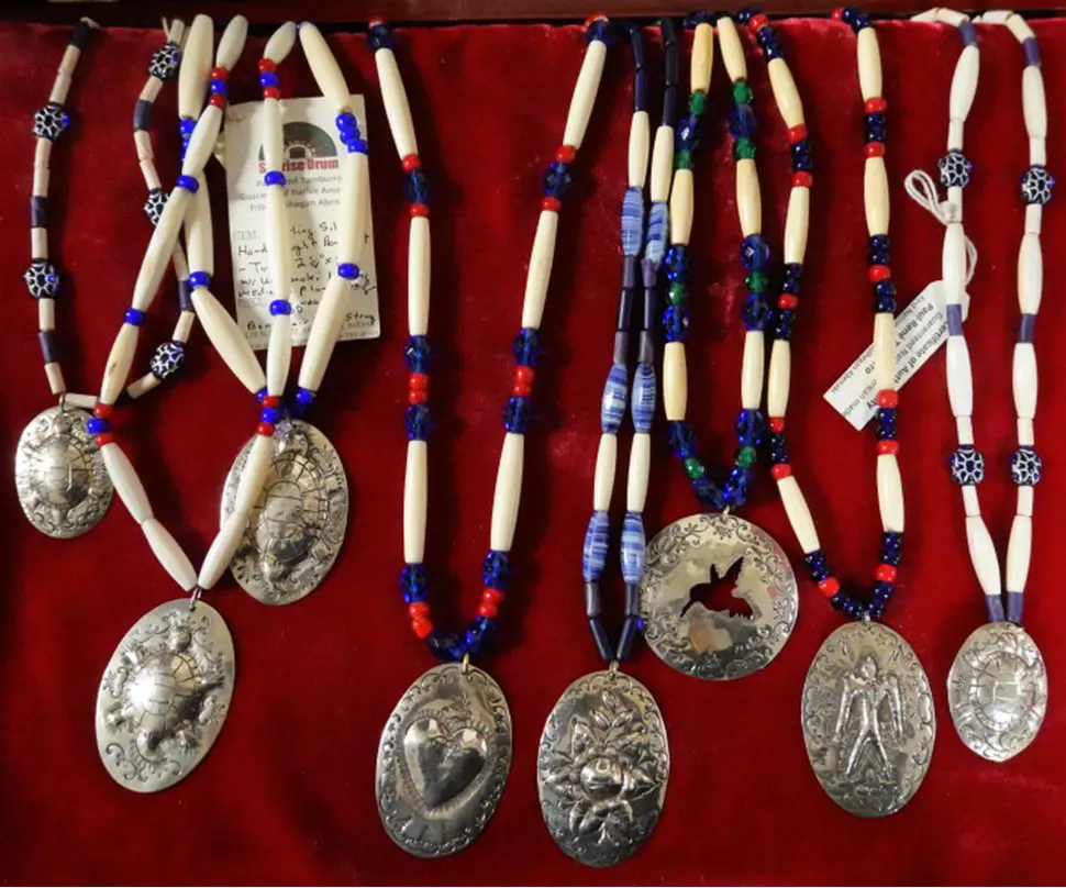 Silver pendants made by Paul Rene Tamburro of Sunrise Drum