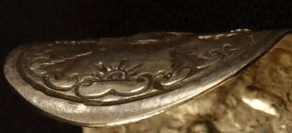 closeup of the edge of a small sterling silver cuff
