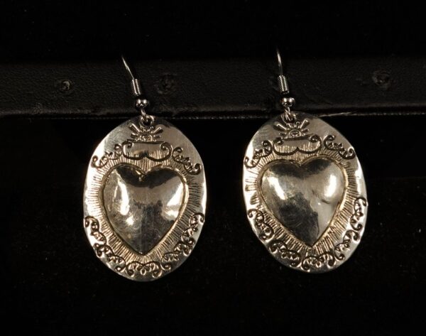 Oval silver heart repoussé earrings by Paul René