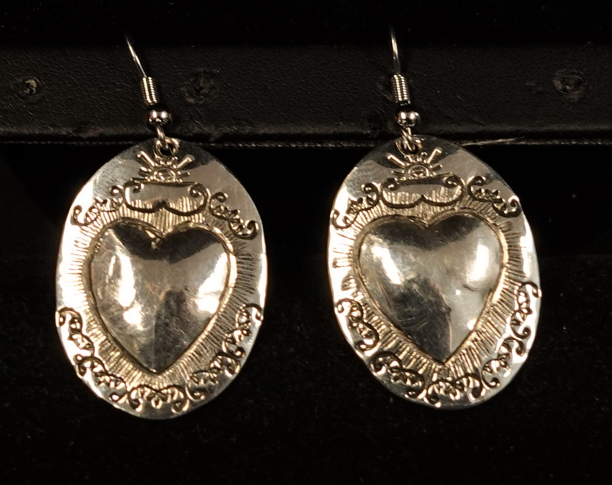 Oval silver heart repousse earrings