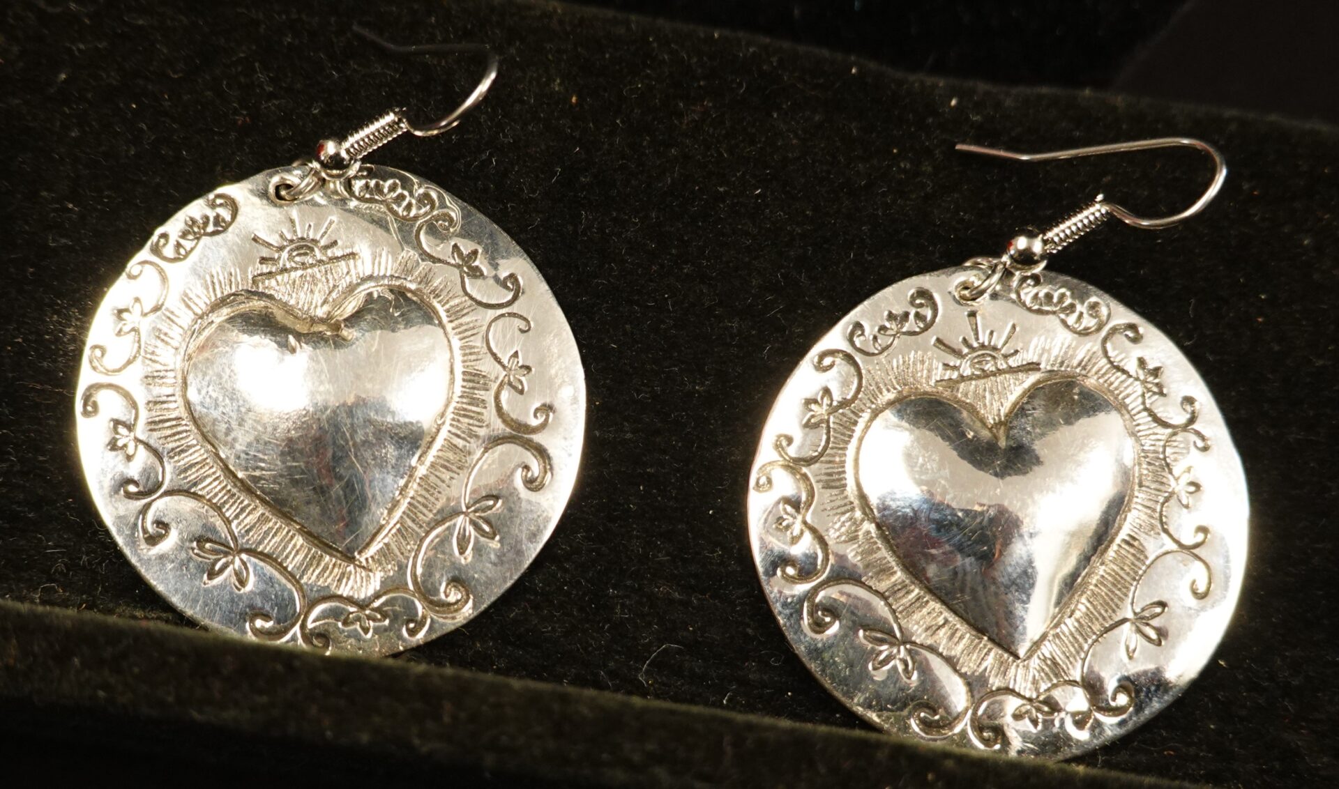 Heart silver repousse earrings at the Sunrise Drum store