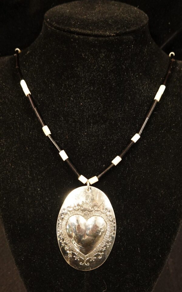 silver heart pendant with blue and white beads