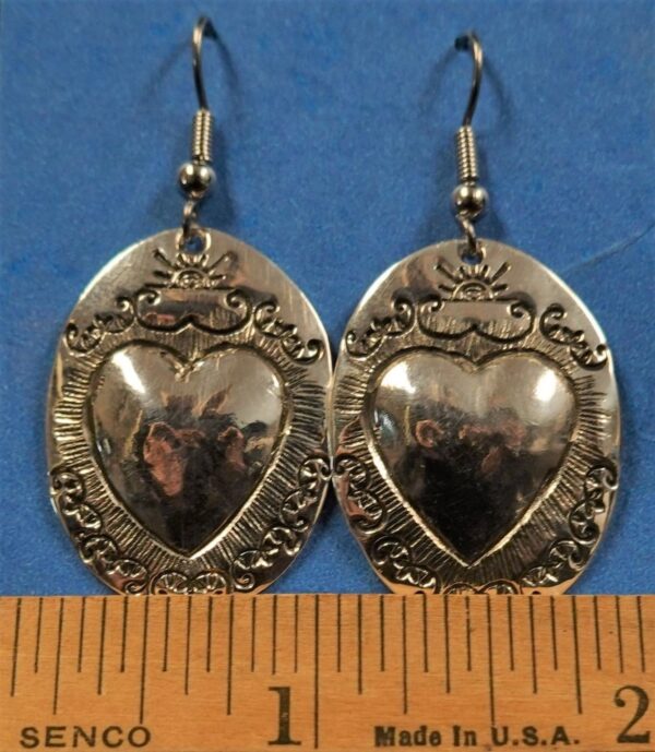 Oval silver heart repoussé earrings