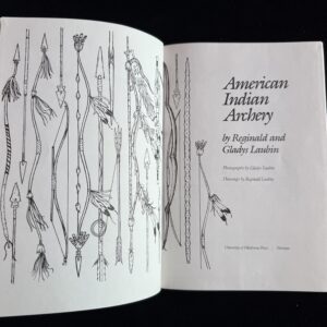 Book titled "American Indian Archery" open.