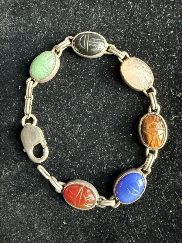 Scarab bracelet multiple types of carved stone
