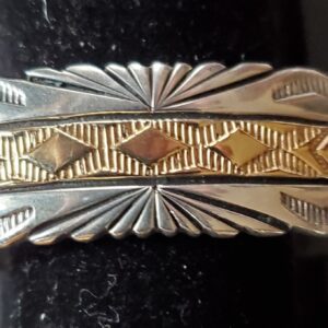 Silver and gold patterned metal ring.