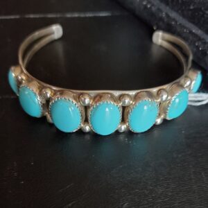 Silver bracelet with turquoise stones.